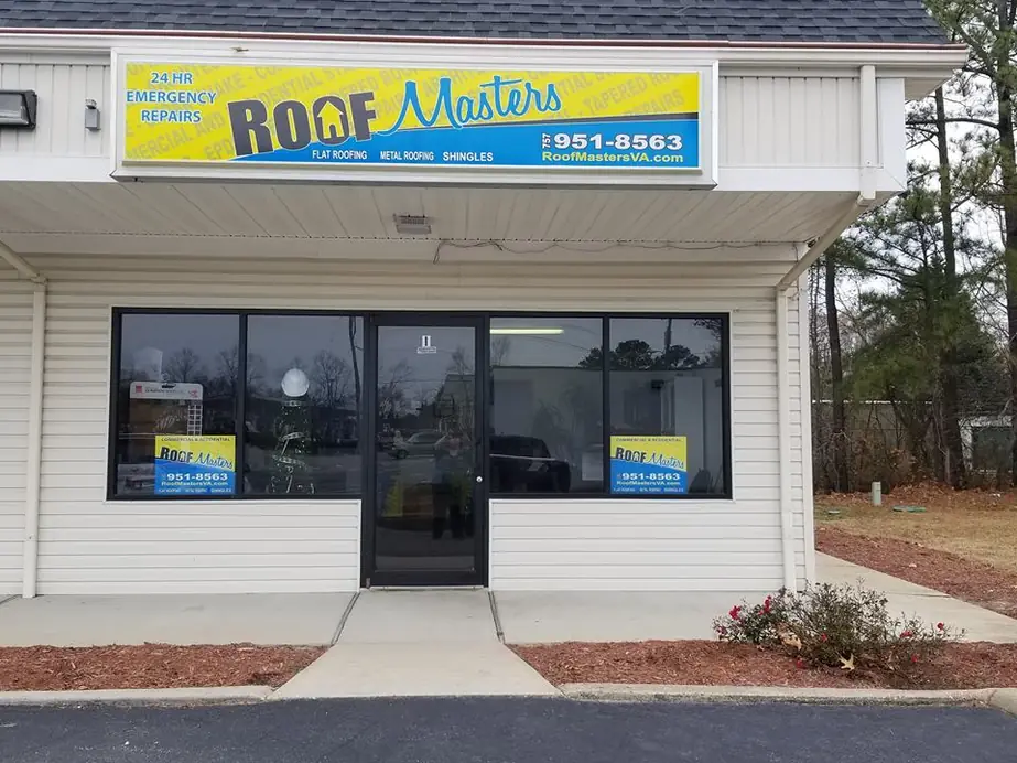 The Roof Masters storefront at 132 Production Dr, Yorktown, with the yellow sign reading 24 HR Emergency Repairs