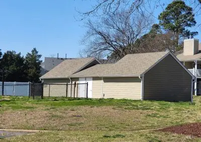 Two small commercial buildings with tan shingles